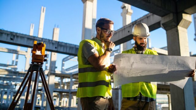 architect-and-engineer-construction-workers-working-at-outdoors-construction-site